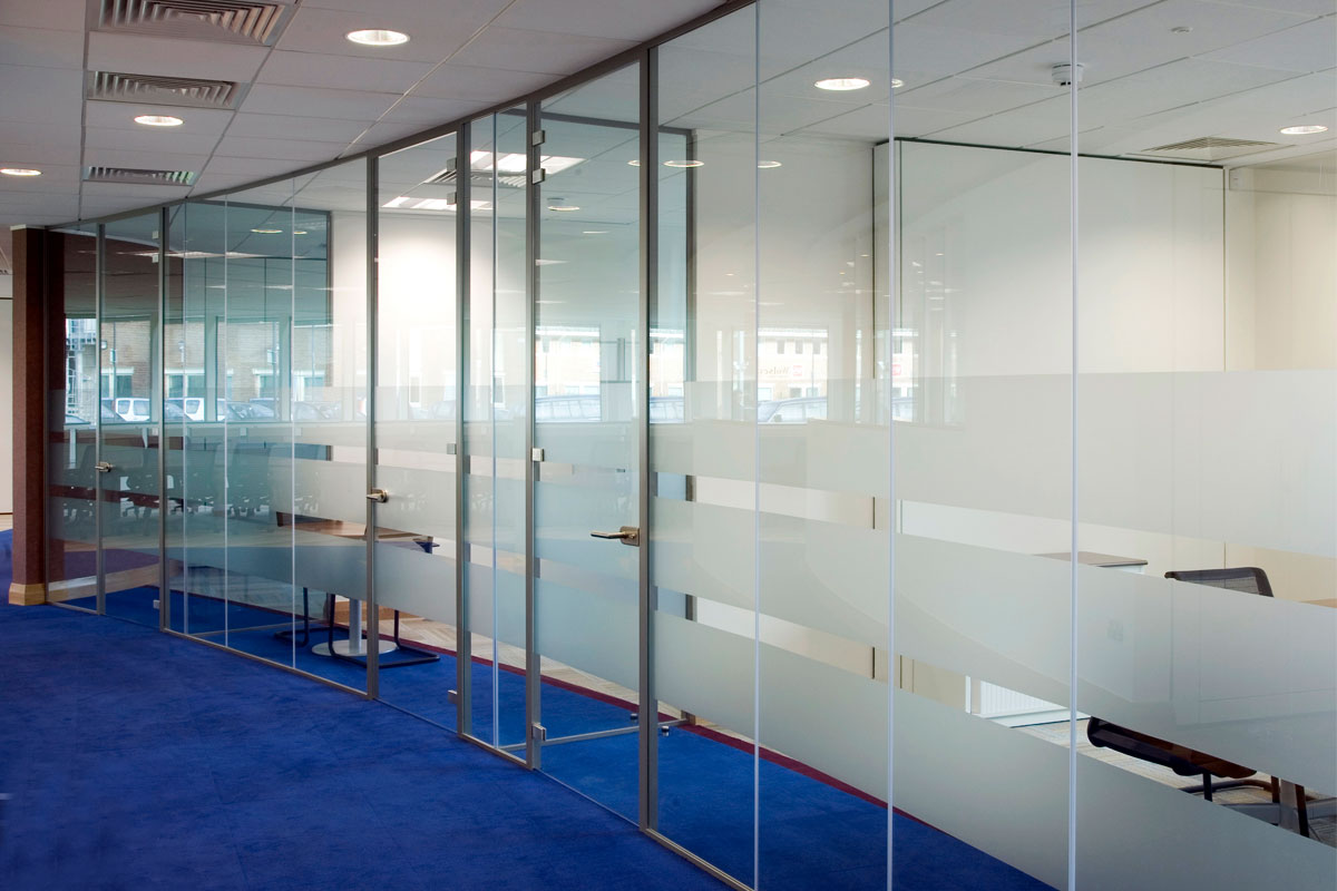 Floor-to-ceiling glass doors in an angled or curved configuration