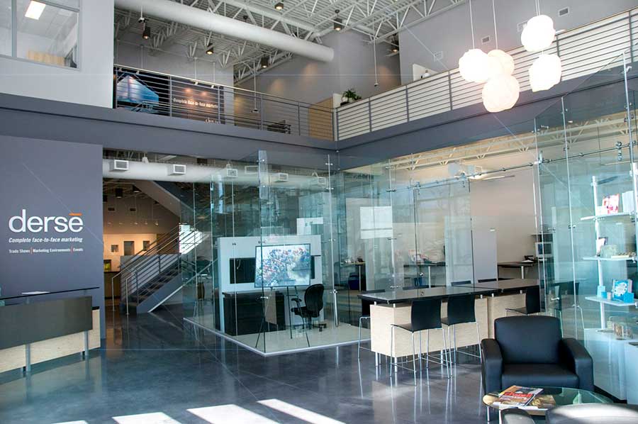 Glass Office Expanding on Fishbowl Workspaces