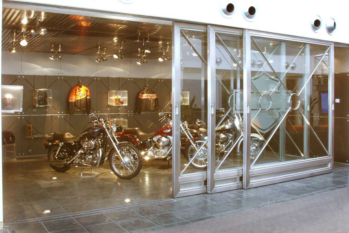 Atrium Glass Walls and Sliding Glass Doors With Harley Davidson Logo