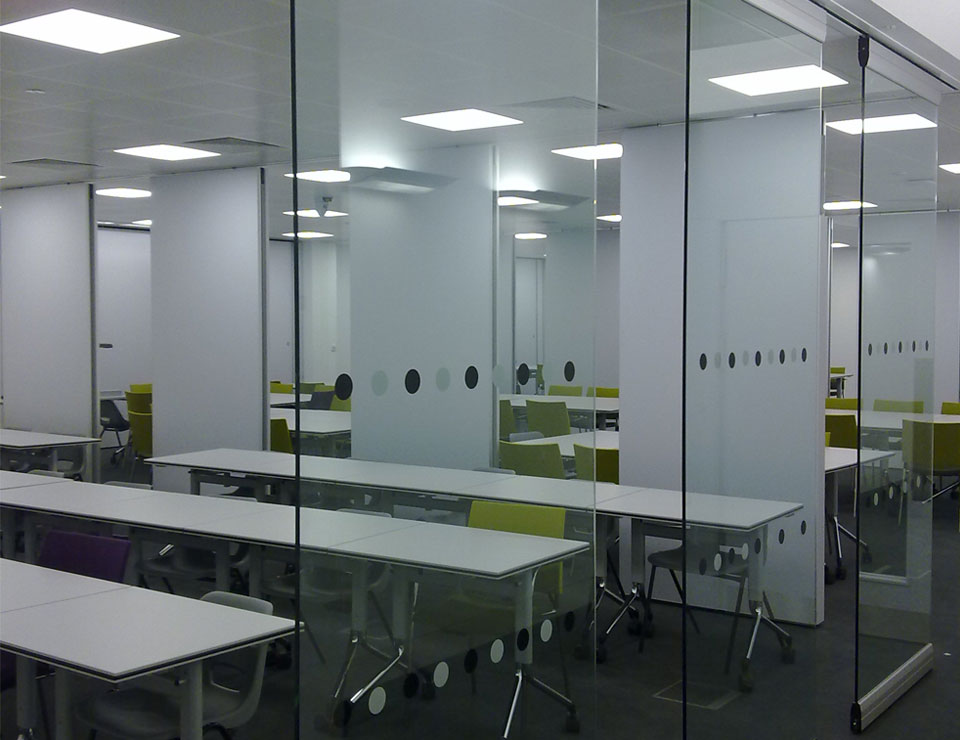 Folding glass wall systems