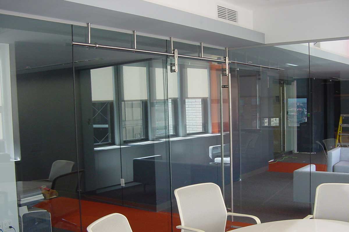 Quiet Closure Benefits From Modern Barn Doors With Glass Partitions