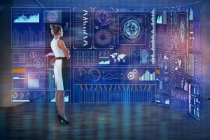 Thoughtful young businesswoman-looking-at-abstract business touchscreen
