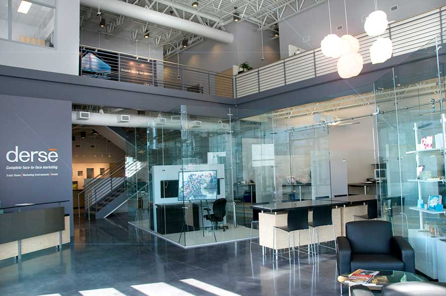 Light floods through the glass office dividers