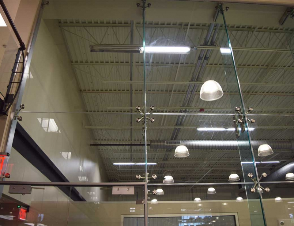 Structural glass wall systems for large office spaces