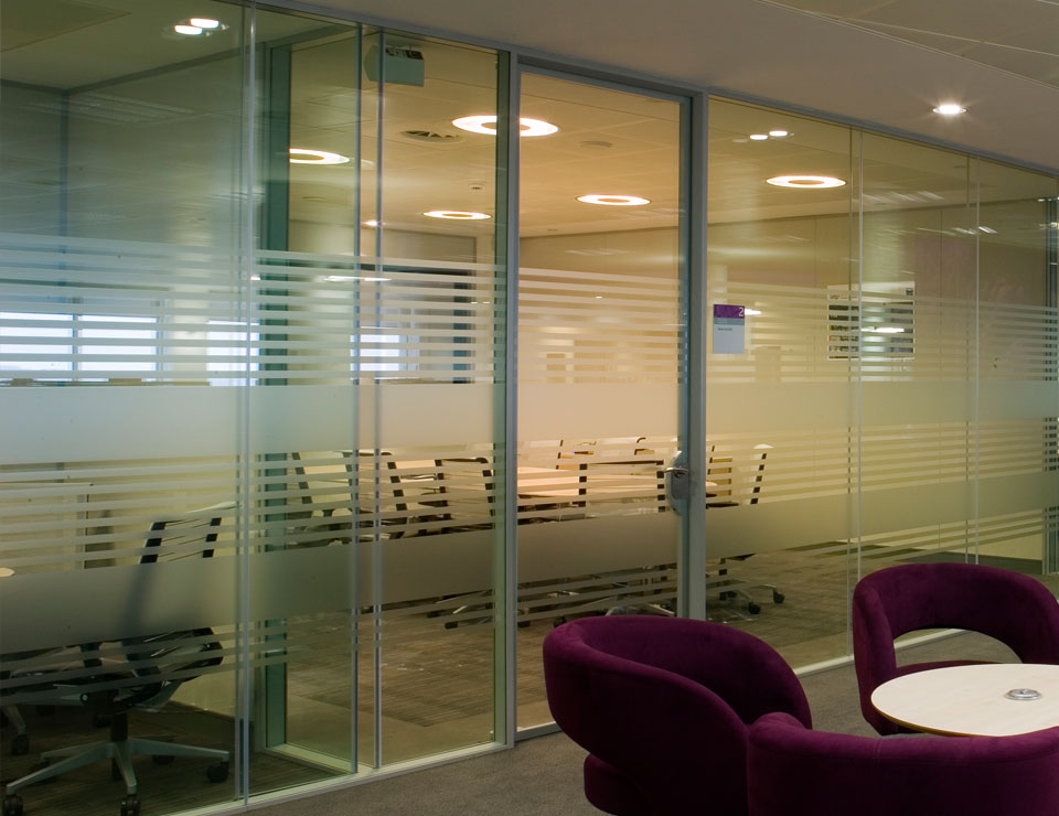 A frosted glass office door along with frosted glass office partitions.